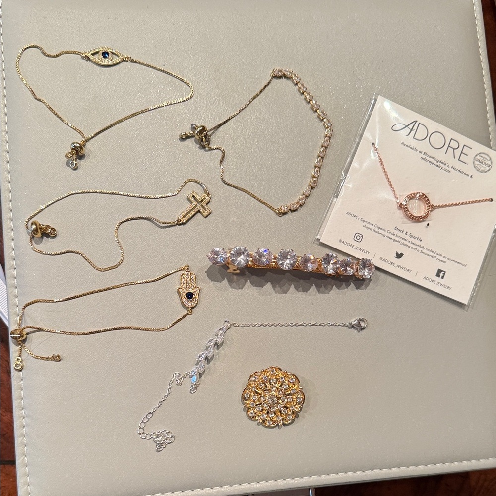 lot of rhinestoned 6 bracelets along with pin and hairclip